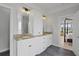 Stylish bathroom featuring dual sinks with granite countertops and a doorway to the luxurious main bedroom at 1216 Rivers Reach Dr, Charleston, SC 29492