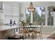 Breakfast nook featuring a large window, light-green painted walls, and a wooden chandelier at 1216 Rivers Reach Dr, Charleston, SC 29492