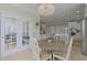 Bright dining area featuring an elegant chandelier and direct access to an outdoor patio area at 1216 Rivers Reach Dr, Charleston, SC 29492
