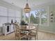 Charming dining area featuring a beaded chandelier and a window with a scenic view at 1216 Rivers Reach Dr, Charleston, SC 29492
