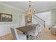 Dining room with hardwood floors, wainscoting, and an elegant chandelier at 1216 Rivers Reach Dr, Charleston, SC 29492