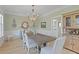 Dining room with hardwood floors, wainscoting, an elegant chandelier, and tasteful decor at 1216 Rivers Reach Dr, Charleston, SC 29492
