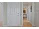 Inviting entryway with wood floors and a view of the formal dining room with a beautiful chandelier at 1216 Rivers Reach Dr, Charleston, SC 29492