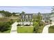 Beautiful two-story home featuring a charming porch, well-manicured lawn, and a tranquil neighborhood setting at 1216 Rivers Reach Dr, Charleston, SC 29492