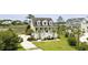 Charming two-story home with landscaped yard, elevated design, and inviting front porch perfect for relaxing at 1216 Rivers Reach Dr, Charleston, SC 29492