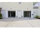Open garage doors reveal ample space, complemented by stylish exterior lighting and landscaping at 1216 Rivers Reach Dr, Charleston, SC 29492