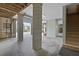 View of the garage, leading to the driveway, featuring stairs and columns at 1216 Rivers Reach Dr, Charleston, SC 29492