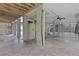 Garage interior featuring a fan, storage cabinets, and support columns at 1216 Rivers Reach Dr, Charleston, SC 29492