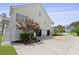 Spacious three-car garage with ample parking space and a neatly landscaped yard at 1216 Rivers Reach Dr, Charleston, SC 29492