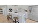 Open kitchen showcases white cabinetry, quartz countertops, stainless steel appliances, and an island with bar seating at 1216 Rivers Reach Dr, Charleston, SC 29492
