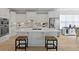 Bright kitchen featuring white cabinets, stainless steel appliances, and a large island with seating at 1216 Rivers Reach Dr, Charleston, SC 29492