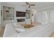 Comfortable living room with fireplace, built-ins, hard wood floors, and ample seating at 1216 Rivers Reach Dr, Charleston, SC 29492