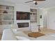 Spacious living room with built-in shelves, a cozy fireplace, and comfortable seating at 1216 Rivers Reach Dr, Charleston, SC 29492