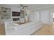 Bright living room boasts custom built-ins surrounding a fireplace and an open floor plan at 1216 Rivers Reach Dr, Charleston, SC 29492