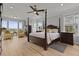Spacious bedroom boasts a four-poster bed, wood floors, an abundance of natural light, and scenic views at 1216 Rivers Reach Dr, Charleston, SC 29492