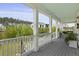Spacious porch with white railings and columns, plus potted plants, offers a great view at 1216 Rivers Reach Dr, Charleston, SC 29492