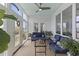 Well-lit sunroom with blue furniture, indoor plants, and multiple windows offering scenic views at 1216 Rivers Reach Dr, Charleston, SC 29492