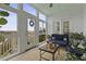 Charming sunroom featuring comfortable blue seating, multiple windows, and scenic outdoor vistas at 1216 Rivers Reach Dr, Charleston, SC 29492