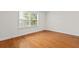 Sunlit bedroom with hardwood floors and a bright window view at 1240 Fairmont Ave # 22, Mount Pleasant, SC 29464