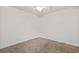 An empty carpeted bedroom featuring ceiling fan and neutral tones at 1240 Fairmont Ave # 22, Mount Pleasant, SC 29464