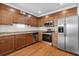 Well-equipped kitchen with stainless steel appliances and wooden cabinetry and granite countertops at 1240 Fairmont Ave # 22, Mount Pleasant, SC 29464