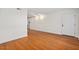 Living room featuring hardwood floors, crown molding, and a white entry door at 1240 Fairmont Ave # 22, Mount Pleasant, SC 29464