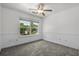 Bright bedroom with carpeting, a ceiling fan, and a large window at 125 Greyson Cir, Goose Creek, SC 29445