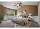 Staged bedroom with decor, paneled walls, and a large window with natural light at 125 Greyson Cir, Goose Creek, SC 29445