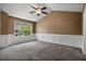 Large bedroom with wainscoting and high ceilings providing view of outdoors at 125 Greyson Cir, Goose Creek, SC 29445