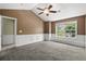 Well-lit bedroom offering neutral tones, carpeted floors, and view of the outdoors at 125 Greyson Cir, Goose Creek, SC 29445