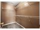Walk-in closet with ample shelving space, carpeting, and a light brown wall color at 125 Greyson Cir, Goose Creek, SC 29445