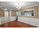 Charming dining room features hardwood floors, stylish lighting, and an open layout to the kitchen at 125 Greyson Cir, Goose Creek, SC 29445