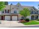 Inviting townhouse featuring a private garage, brick accents, and an adorable green front lawn at 125 Greyson Cir, Goose Creek, SC 29445