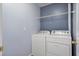 Practical laundry room featuring a washer, dryer, and shelving at 125 Greyson Cir, Goose Creek, SC 29445