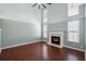 Bright living room features a fireplace, hardwood floors, and tall ceilings at 125 Greyson Cir, Goose Creek, SC 29445