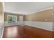 Inviting living area with gleaming hardwood floors, chair rail molding, and a bright window at 125 Greyson Cir, Goose Creek, SC 29445