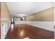 Spacious living room boasts beautiful hardwood floors, elegant wall trim, and ample natural light at 125 Greyson Cir, Goose Creek, SC 29445