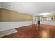 Spacious living room boasts gorgeous hardwood floors, stylish trim, and seamless access to the dining area at 125 Greyson Cir, Goose Creek, SC 29445