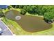 An aerial view of the community pond with a fountain, green space, and surrounded by trees at 125 Greyson Cir, Goose Creek, SC 29445