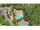 Aerial view showcasing the community pool area with lounge chairs and mature trees, creating a relaxing atmosphere at 125 Greyson Cir, Goose Creek, SC 29445
