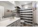 Modern bathroom features a sleek vanity, decorative shelves, and a stylish shower curtain at 125 Integrity Ln, Charleston, SC 29492
