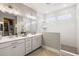 Modern bathroom with a double sink vanity, white cabinets, and a glass-enclosed shower at 125 Integrity Ln, Charleston, SC 29492