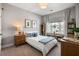 Bright bedroom features a plush bed, framed prints and a window for natural light at 125 Integrity Ln, Charleston, SC 29492