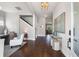 Elegant foyer with hardwood floors, stylish console table and bench seating, leading to staircase and living spaces at 125 Integrity Ln, Charleston, SC 29492