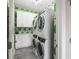 Efficient laundry room features stacked washer and dryer units and ample cabinet space at 125 Integrity Ln, Charleston, SC 29492
