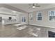 Bright, open-concept living room and kitchen with light wood floors and stainless steel appliances at 125 Integrity Ln, Charleston, SC 29492