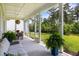 Relaxing screened-in porch with comfortable seating and views of the lush backyard at 125 Integrity Ln, Charleston, SC 29492