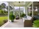 Cozy screened-in porch with comfortable seating, offering serene outdoor living space at 125 Integrity Ln, Charleston, SC 29492