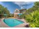 Gorgeous backyard showcasing a private pool, patio area, and lush tropical landscaping at 1308 Divot Ct, Mount Pleasant, SC 29466
