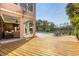 Exterior view of the house showing the wooden deck and outdoor seating by the pool at 1308 Divot Ct, Mount Pleasant, SC 29466